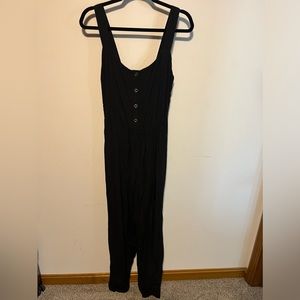 Black (large) jumpsuit- never worn/still has the tag. Original price $48